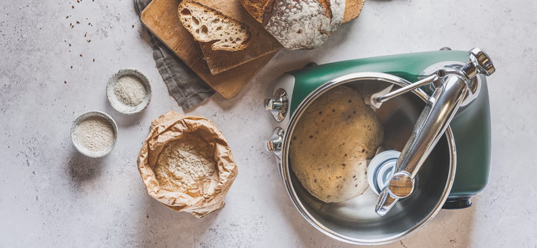 A loaf of bread sitting on top of a wooden cutting board.