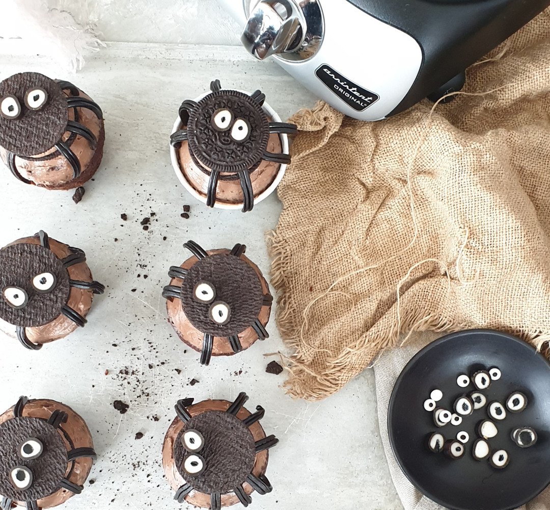 A group of halloween cookies sitting on top of a counter.