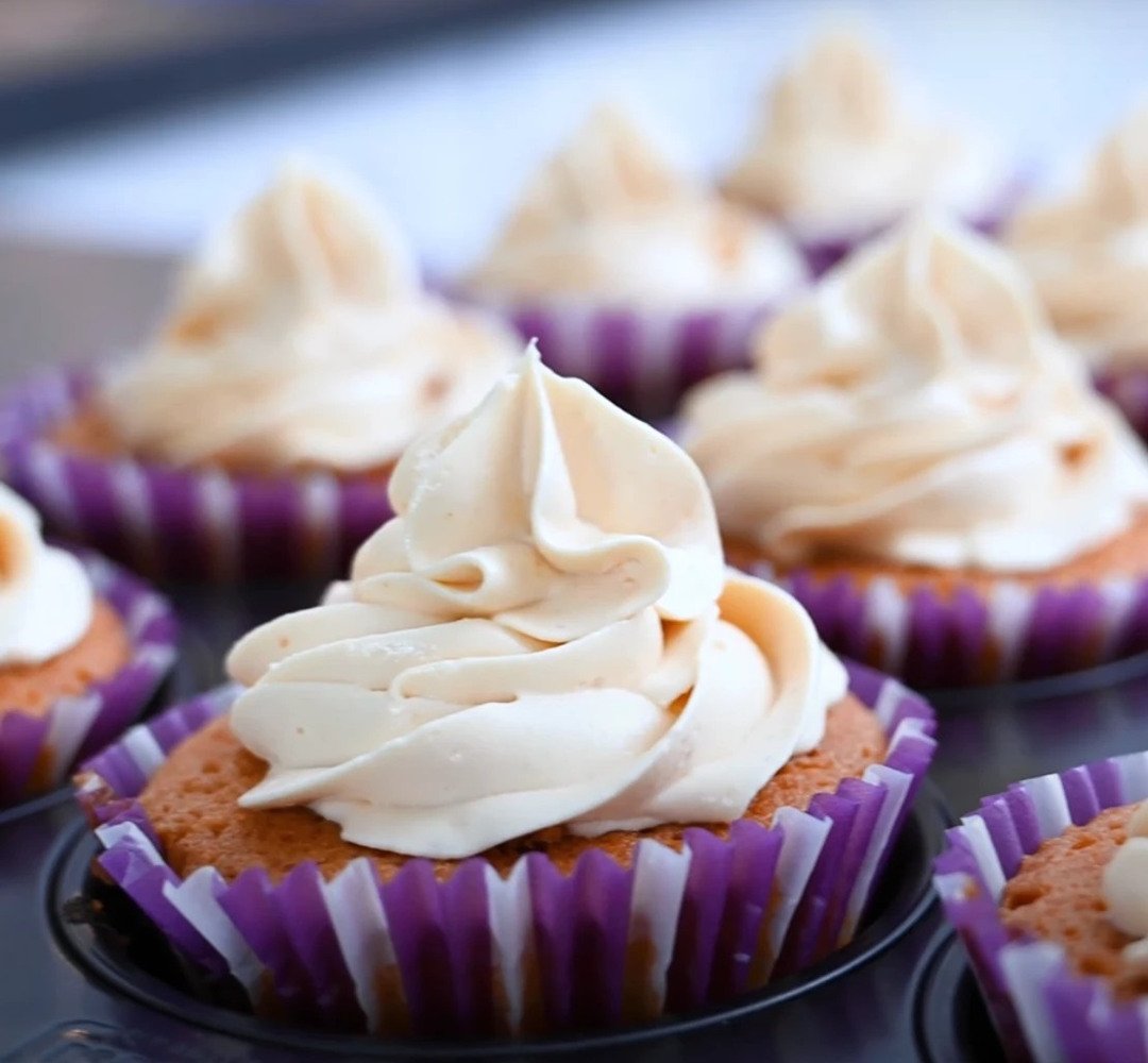 A close up of cupcakes with frosting on them.