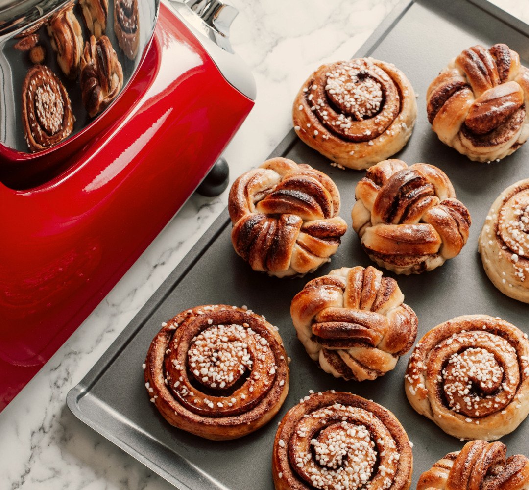 Cinnamon buns on a baking tray