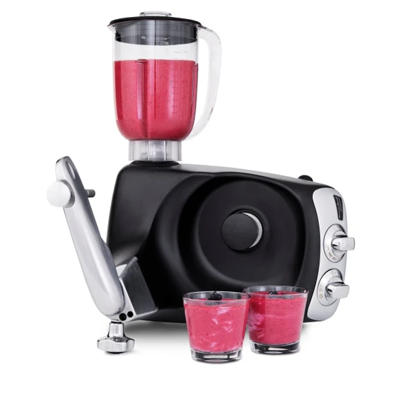 Ankarsrum Assistent Original équipée du mélangeur, préparant un smoothie, avec deux verres de smoothie prêt à côté.