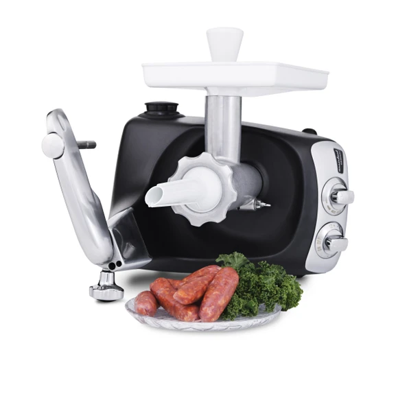 Ankarsrum Assistent Original with the Sausage Horn attached, with freshly made sausages on a plate beside it.