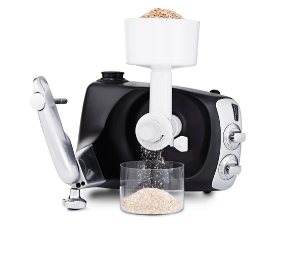 Ankarsrum Assistent Original with the Grain Mill attached, grinding grain into flour.