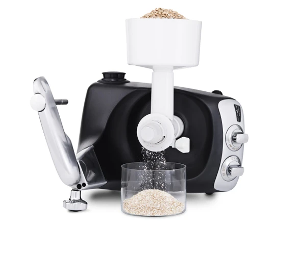 Ankarsrum Assistent Original with the Grain Mill attached, grinding grain into flour.