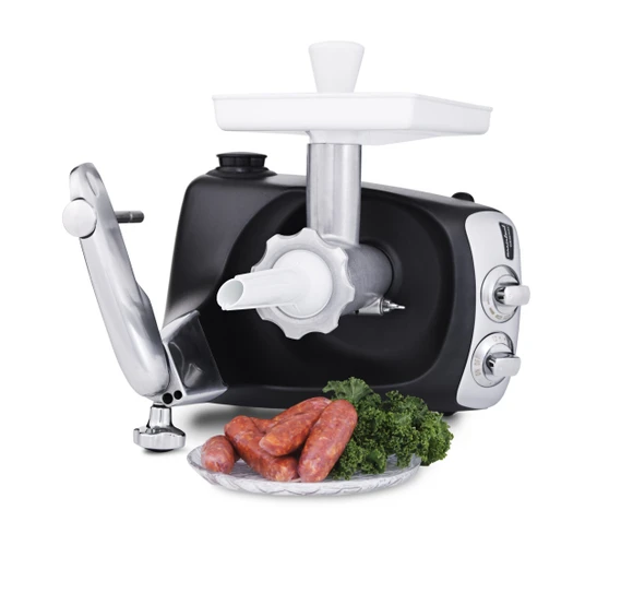 Ankarsrum Assistent Original with the Sausage Horn attached, with freshly made sausages on a plate beside it.