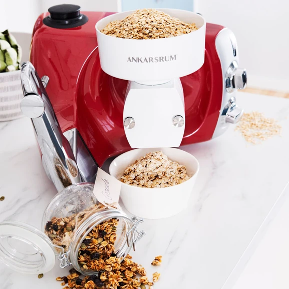 Ankarsrum Assistent Original with the Flake Mill attached, flaking oats for homemade granola.